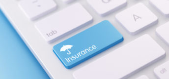 A white keyboard with a blue key that says 'insurance' on it